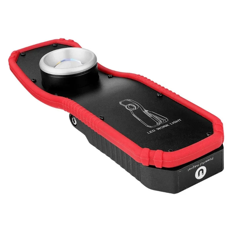 Black and red LED work light for garage or workshop with durable protective edging