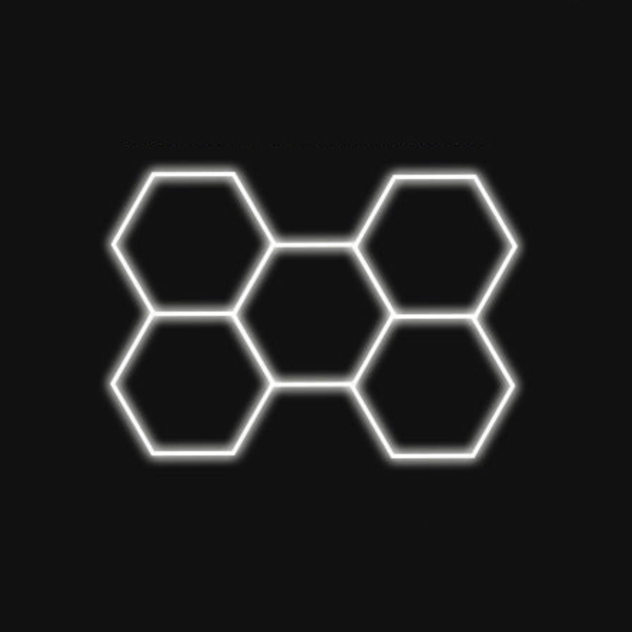 Hexagon LED garage ceiling light panel glowing on black background