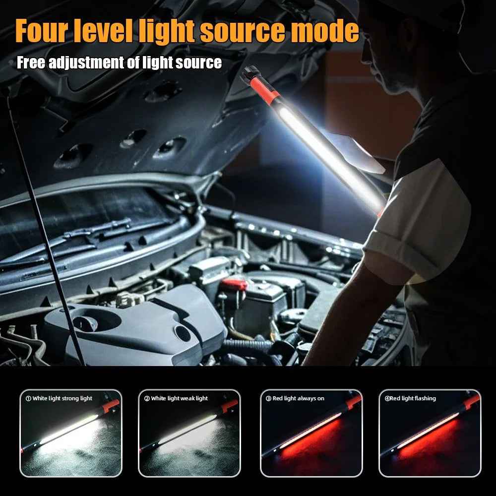 Mechanic using LED work light with four lighting modes to illuminate car engine in garage